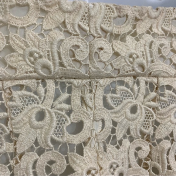 Ivory lace dress by Michael Kors is in like new condition. Size 2 - Picture 11 of 16